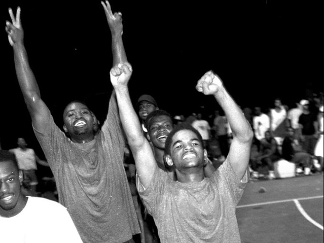 Dion Layfield and LaTerrious Hurt of the East End team celebrating a victory in the 1995 Dirt Bowl (photo by Keith Williams, courtesy of the Courier-Journal)
